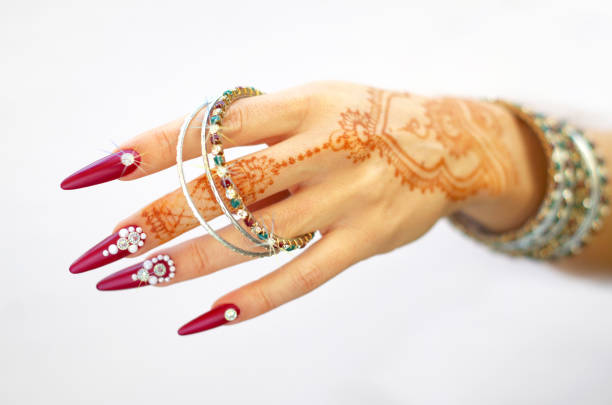 istock nails decorated with brilliant and hand with henna tattoos 1054470620