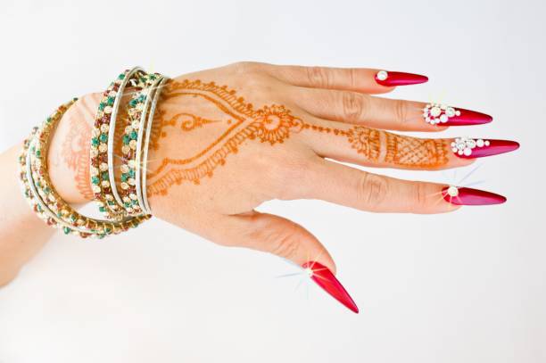 istock nails decorated with brilliant and hand with henna tattoos 1054470764