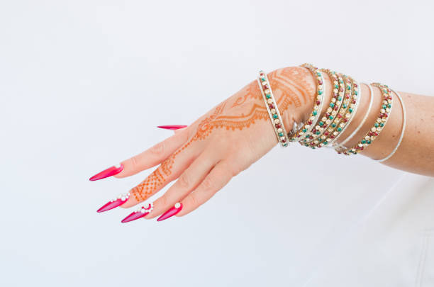 istock nails decorated with brilliant and hand with henna tattoos 1054474192