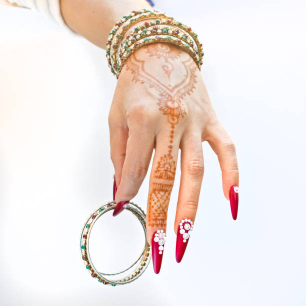 istock nails decorated with brilliant and hand with henna tattoos 1054474226