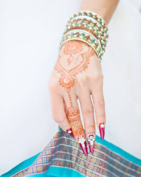 istock nails decorated with brilliant and hand with henna tattoos 1054474478