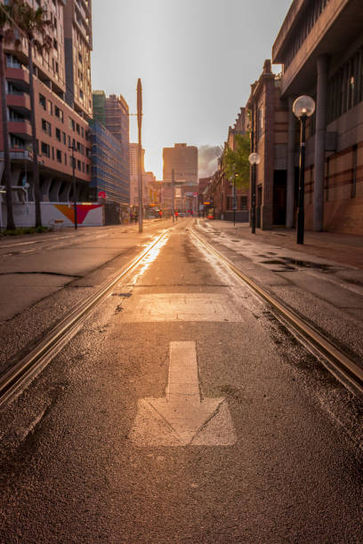 istock Empty street with tram line and arrow on the road. 1054477488
