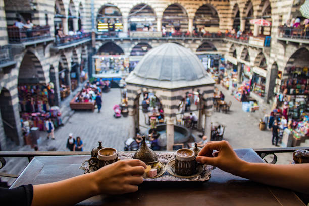 turkish coffee in Diyarbakir Hasanpasa Khan hasanpaşa khan is a historical caravanserai, now open to the public, where people drink coffee they chat cezve stock pictures, royalty-free photos & images