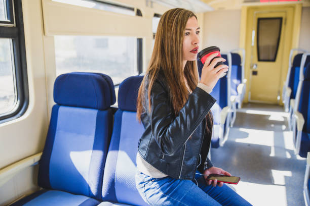 istock Young woman at train. 1054483244