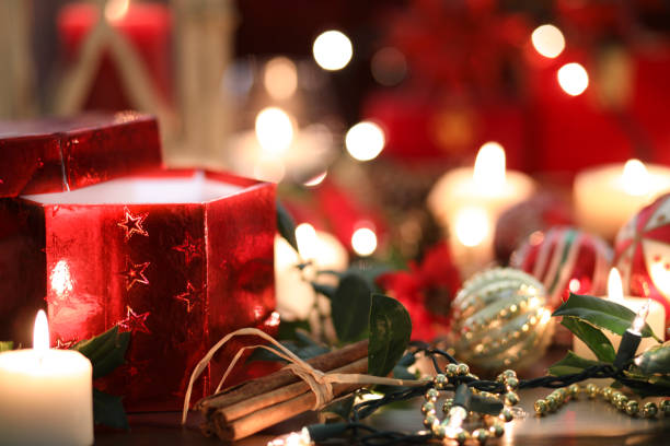 istock Christmas holiday decorations, candles, gift on table. 1054483760