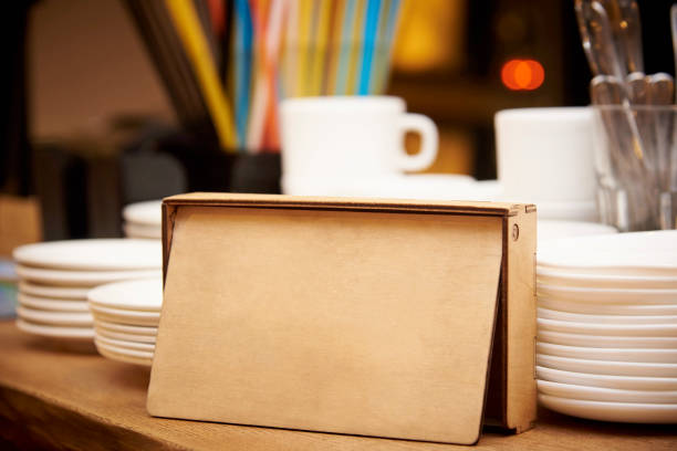 istock Wooden box on the table with stacks of plates and cups. 1054483828