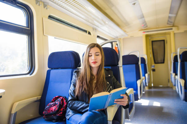istock Traveling by train and reading a book. 1054484692