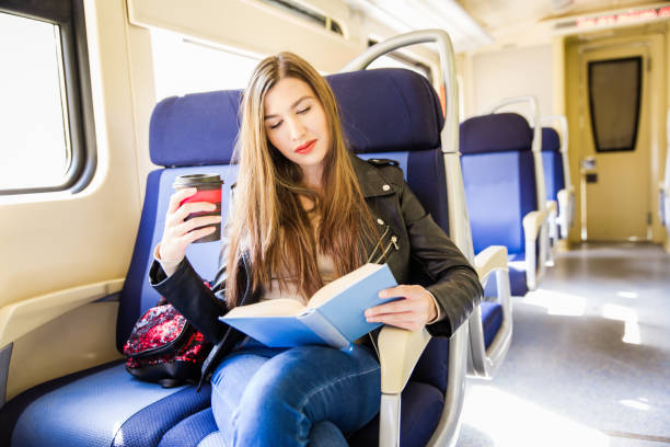istock Woman in train with a book. 1054485110