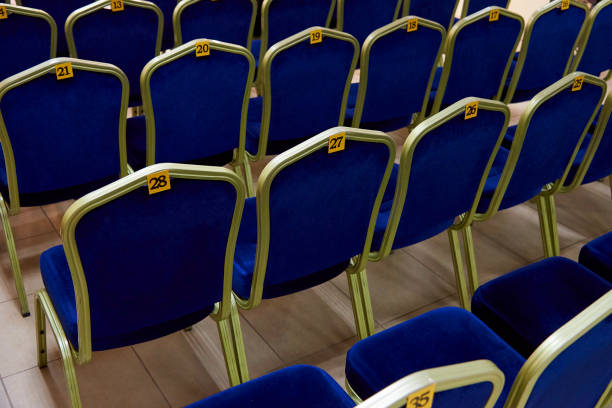 istock Rows of blue chairs with numbers close-up. 1054485364