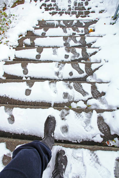 istock A woman wants to go down a slippery staircase 1054488652