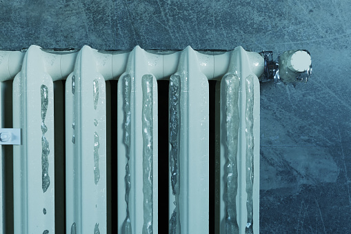 3d rendering of an old heat radiator covered with ice because of energy poverty