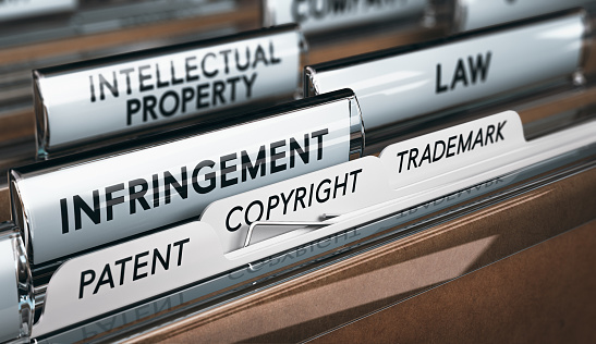 Derechos de propiedad intelectual, derechos de autor, patente o infracción de marcas photo