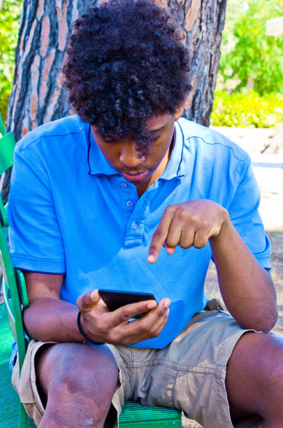 istock boy works with the smartphone 1054517096