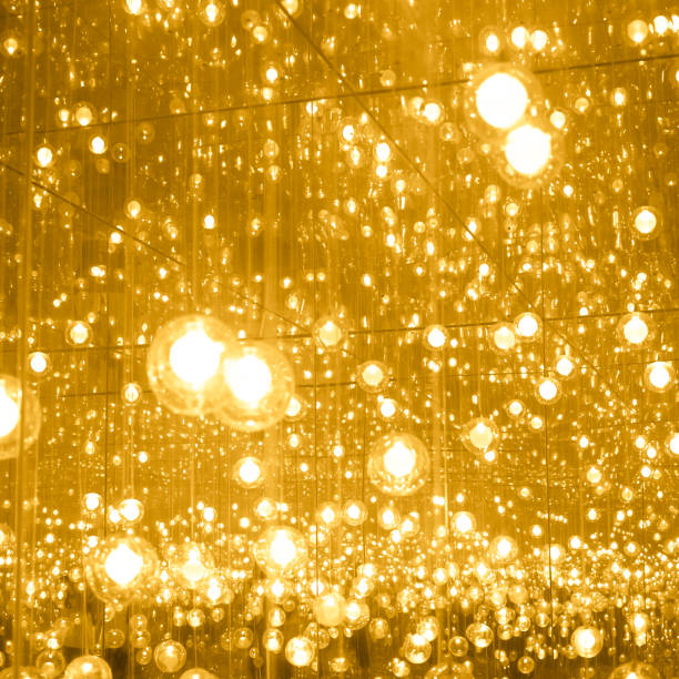 istock Gold glitter christmas balls hanging particles background 1054522998