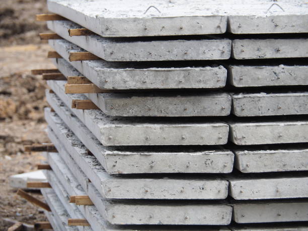 istock Prestressed Floor planks stacked for construction. It is a slab of reinforced concrete. Put together Structural Topping (concrete composite topping) will work in the same with the finished floor. 1054535724