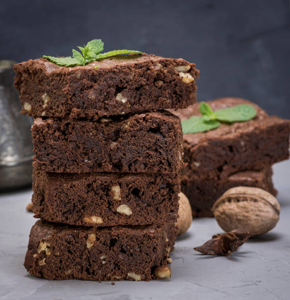 istock stack of baked square pieces of brownie pie 1054538742