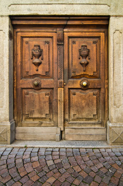 istock antique wooden door with handle and decorations 1054540020