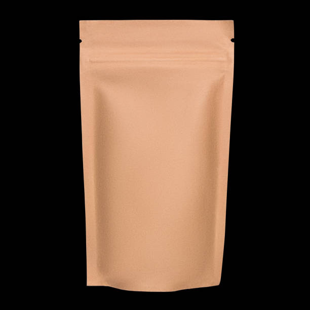 istock Blank brown kraft paper bag with zipper isolated on black background 1054546220
