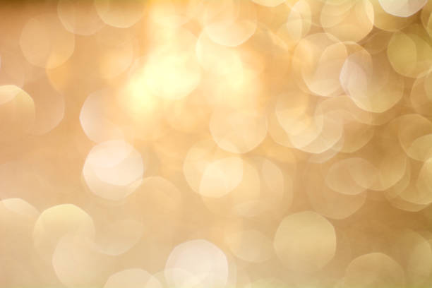 istock Gold Bokeh Background. The background with boke. Abstract texture. Color circles. Blurred. 1054546256
