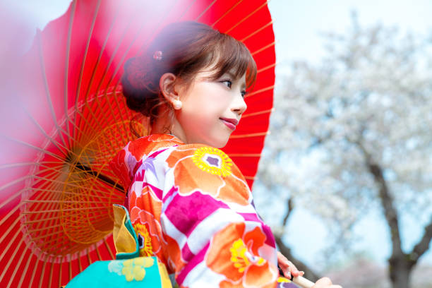 istock Young asian girl wearing kimono (Japanese traditional clothes). 1054548424