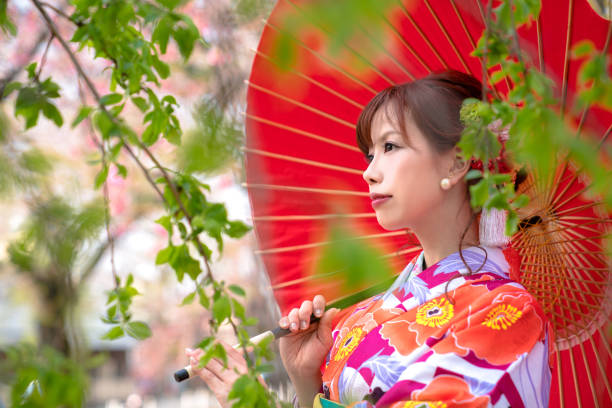 istock Young asian girl wearing kimono (Japanese traditional clothes). 1054548450