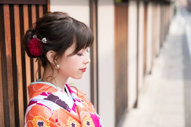 istock Young asian girl wearing kimono (Japanese traditional clothes). 1054548452