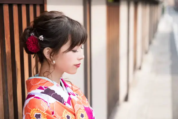 Young asian girl wearing kimono (Japanese traditional clothes).