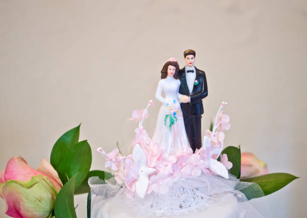istock figurines of the bride and groom wedding cake 1054551654