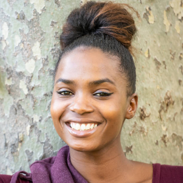 istock Smiling beautiful young black woman 1054551816