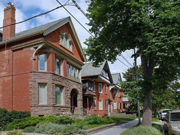 istock row of large old brick houses with gables 1054551900