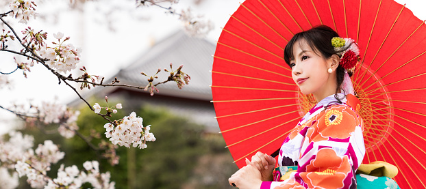 Young asian girl wearing kimono (Japanese traditional clothes).