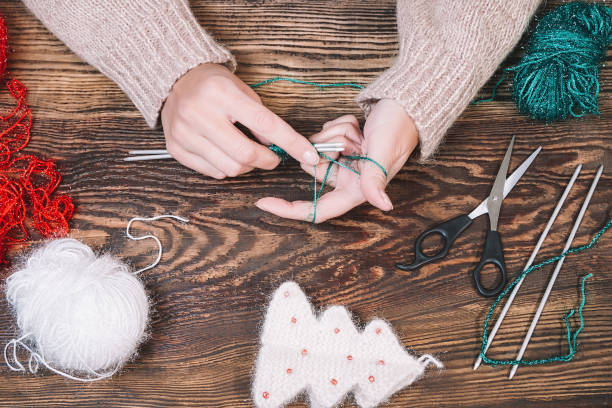 istock Knitting. Hand Crochet.  Female hand knit hook. 1054556634