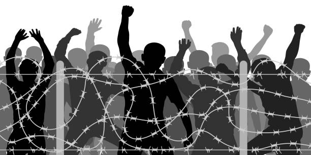 Crowd people behind barbed wire, vector silhouette. Migrants and refugee stand behind the barrier fence, protest demonstration. No passage Crowd people behind barbed wire, vector silhouette. Migrants and refugee stand behind the barrier fence, protest demonstration. No passage angry crowd stock illustrations