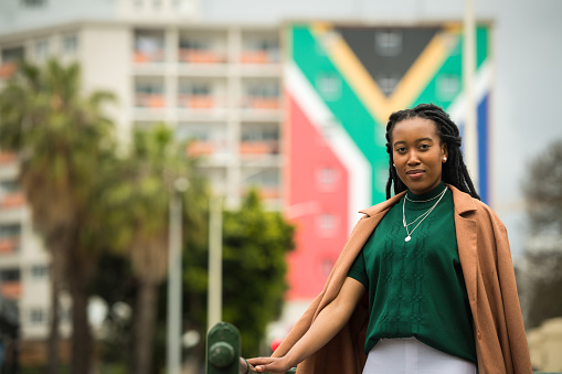 Businesswoman with the South African flag in the background