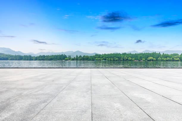 istock Empty floor and beautiful mountain with lake 1054575396