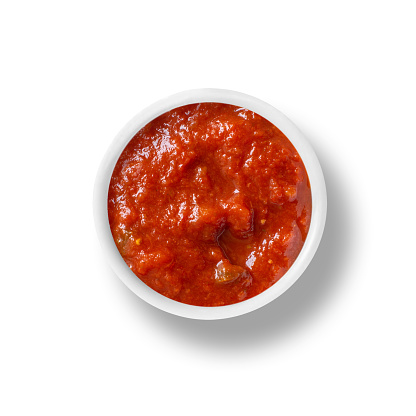 small bowl of marinara tomato sauce isolated on white. top down view from above