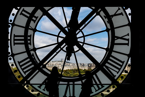 Paris, France - September 20, 2018: Musee d'Orsay visitors looking at Montmartre view through the giant glass clock - Paris, France