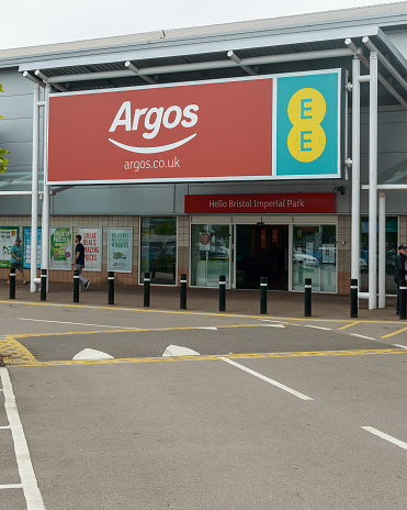 Bristol, England - May 28, 2018: Entrance to Argos and EE mobile network store, Bristol Imperial Park, modern architecture shallow depth of field
