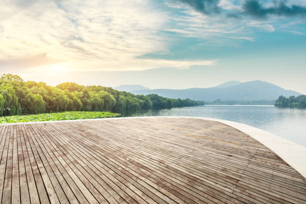 istock Wooden platform and beautiful mountain with lake 1054586144