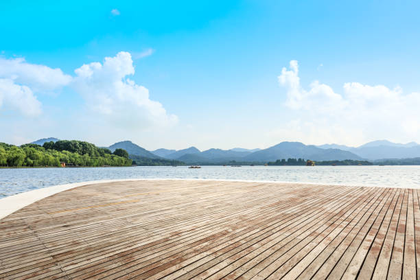 Wooden platform and beautiful mountain with lake stock photo