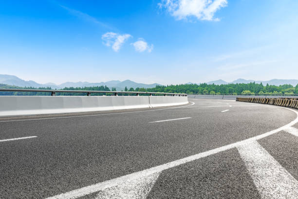istock Asphalt road and beautiful mountain under the blue sky 1054598728