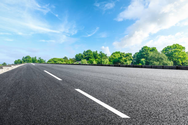 istock Asphalt road and beautiful forest scenery 1054601860