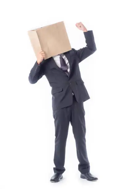 Photo of business person concept.blank space paper bag over head businessman in suit and black necktie with white background isolated.