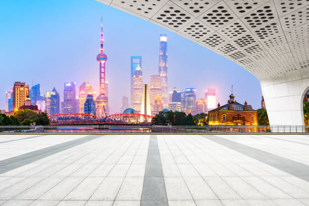 istock Empty floor and modern city buildings in Shanghai at night 1054610090