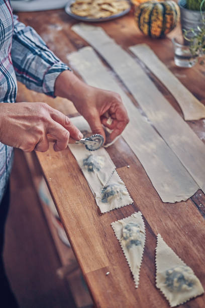 istock Preparing Spinach Pumpkin Ravioli with Thyme and Chili 1054614392