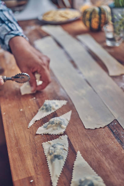 istock Preparing Spinach Pumpkin Ravioli with Thyme and Chili 1054614406