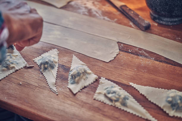 istock Preparing Spinach Pumpkin Ravioli with Thyme and Chili 1054614420