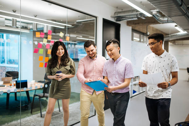 istock Young business team in modern co-working space 1054619138