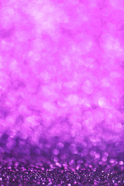 istock Purple bokeh holiday textured glitter background 1054624042