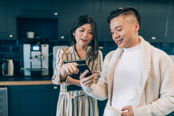 istock Taiwanese business people looking at mobile phone 1054624096